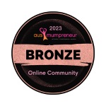 Round award badge, rose gold text and accents on black background with hot pink logo. Bronze Winner - Online Community Ausmumpreneur Awards 2023.